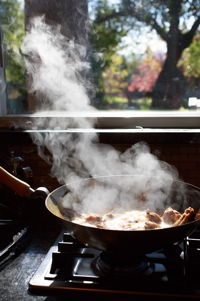 Chicken Wings searing in a hot wok.