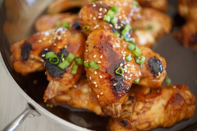 Close up of golden brown Asian chicken wings.