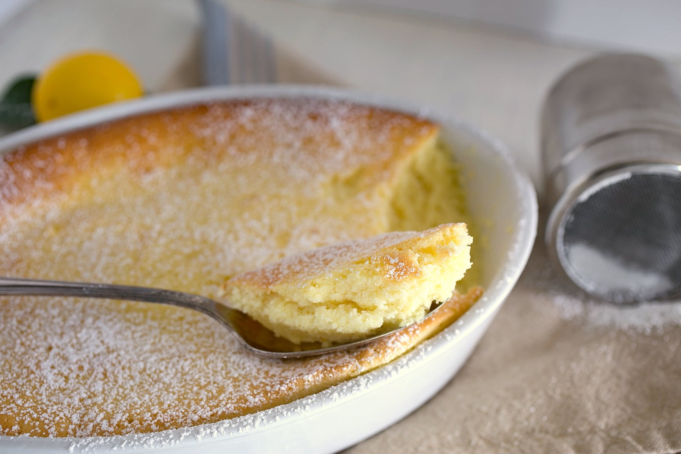 A spoonful of lemon souffle cake.